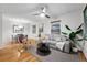 Inviting living room features hardwood floors, neutral tones, and a contemporary ceiling fan at 8881 Lilly Dr, Thornton, CO 80229