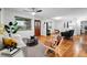Bright living room boasts hardwood floors and a neutral color palette with lots of natural light at 8881 Lilly Dr, Thornton, CO 80229