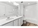 Main bathroom with double vanity and bathtub at 4527 Boone Cir, Brighton, CO 80601