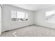 Bedroom with neutral carpeting and window views at 4527 Boone Cir, Brighton, CO 80601