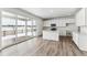 Modern kitchen with white cabinets, island and stainless steel appliances at 4527 Boone Cir, Brighton, CO 80601