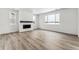 Spacious living room featuring a fireplace and large windows at 4527 Boone Cir, Brighton, CO 80601