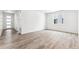 Living room with wood-look floors and an entryway at 4527 Boone Cir, Brighton, CO 80601