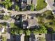 Aerial view showcasing the property, the surrounding neighborhood, mature trees and landscaping at 8394 S Everett Way # E, Littleton, CO 80128
