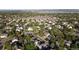 Aerial view of the neighborhood showcasing the community's layout, landscaping, and nearby lake at 8394 S Everett Way # E, Littleton, CO 80128