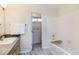Clean bathroom with a single sink, shower/tub combination and neutral decor at 8394 S Everett Way # E, Littleton, CO 80128
