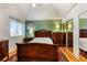 Comfortable bedroom featuring hardwood floors, a window for natural light, and a mirrored closet at 8394 S Everett Way # E, Littleton, CO 80128