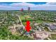 Expansive aerial view showcases home's prime location within a lush, green neighborhood at 6335 Oberon Rd, Arvada, CO 80004