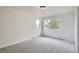 Bright bedroom features neutral carpet, large windows with natural light, and closet at 6335 Oberon Rd, Arvada, CO 80004