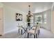 Cozy dining room featuring modern table, comfortable seating, stylish decor, and a bright window at 6335 Oberon Rd, Arvada, CO 80004