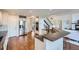Open kitchen featuring modern appliances, granite countertops, and a breakfast bar for casual dining at 6335 Oberon Rd, Arvada, CO 80004