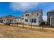 Exterior back view of a new construction two-story home with white siding at 25234 E Warren Pl, Aurora, CO 80018