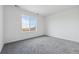 Well-lit bedroom with neutral colored carpet, neutral paint, and natural light at 25234 E Warren Pl, Aurora, CO 80018