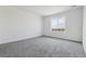 Well-lit bedroom with neutral colored carpet, neutral paint, and natural light at 25234 E Warren Pl, Aurora, CO 80018