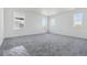 Spacious bedroom with plush carpeting and views from the large window at 25234 E Warren Pl, Aurora, CO 80018