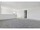 Bright living room with neutral colored carpet, neutral paint, and natural light at 25234 E Warren Pl, Aurora, CO 80018