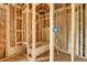 Unfinished bathroom features wood framing, bathtub, and exposed electrical wiring at 404 S Oneida Way, Denver, CO 80224