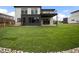 Modern home featuring a lush, newly installed lawn, and a spacious covered patio for outdoor entertaining at 5224 Lions Paw St, Castle Rock, CO 80104