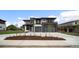 Contemporary two-story home featuring a balcony, modern design, and an attached two-car garage at 5224 Lions Paw St, Castle Rock, CO 80104