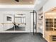 Home gym features mirrors, barre, a bike, and a sauna for a complete workout experience at 5224 Lions Paw St, Castle Rock, CO 80104