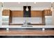Chef's kitchen with stainless appliances, stylish hardware, and designer backsplash at 5224 Lions Paw St, Castle Rock, CO 80104