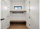 Well-organized mudroom with storage bench, coat hooks, and convenient access to entryways at 5224 Lions Paw St, Castle Rock, CO 80104