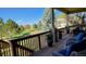 Private back deck overlooking the backyard with lots of trees and a view at 16699 Las Brisas Dr, Broomfield, CO 80023