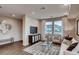 Bright living room featuring hardwood floors, stylish decor and lots of natural light at 17113 W 91St Ln, Arvada, CO 80007