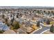 An aerial view showcasing the neighborhood with lush greenery and mountain views at 1104 Fieldstone Pl, Highlands Ranch, CO 80126