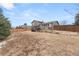 Enjoy the spacious fenced backyard with deck; ideal for outdoor gatherings and relaxation at 1104 Fieldstone Pl, Highlands Ranch, CO 80126