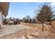 Spacious backyard boasts a patio with grill, a stone area, and grass; perfect for outdoor entertaining at 1104 Fieldstone Pl, Highlands Ranch, CO 80126