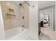 Bathroom featuring a tub-shower combination with tiled walls and a vanity with a dark wood cabinet at 1104 Fieldstone Pl, Highlands Ranch, CO 80126