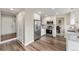 Modern kitchen featuring white cabinets, stainless steel appliances, and granite countertops at 1104 Fieldstone Pl, Highlands Ranch, CO 80126