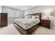 Serene main bedroom features a king-size bed, plush bedding, and natural light from the window at 1104 Fieldstone Pl, Highlands Ranch, CO 80126