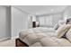 Calm main bedroom with carpet, a bed with white comforter, and a window with lots of light at 1104 Fieldstone Pl, Highlands Ranch, CO 80126