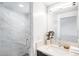 Sleek bathroom with a glass-enclosed shower, modern fixtures, and stylish design elements at 3658 Quivas St, Denver, CO 80211