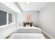 Serene bedroom with soft colors, a comfortable bed, and warm lighting creating a relaxing atmosphere at 3658 Quivas St, Denver, CO 80211