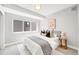 Cozy bedroom featuring ample light, a stylish bed, and tasteful decor for a comfortable living space at 3658 Quivas St, Denver, CO 80211