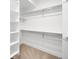 Walk-in closet with built in shelving and ample storage at 3658 Quivas St, Denver, CO 80211
