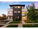 Stylish modern home with manicured lawn, a paved walkway, and tasteful landscaping at 3658 Quivas St, Denver, CO 80211