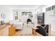 Cozy living room with a modern fireplace, hardwood floors, and lots of natural light at 3658 Quivas St, Denver, CO 80211