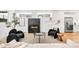 Cozy living room featuring a modern fireplace, stylish seating, and lots of natural light at 3658 Quivas St, Denver, CO 80211