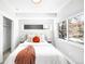 Bright main bedroom with a comfy bed, stylish throw, and abundant natural light at 3658 Quivas St, Denver, CO 80211
