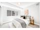 Cozy main bedroom with modern artwork, soft lighting, and a serene atmosphere at 3658 Quivas St, Denver, CO 80211