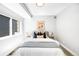 Inviting main bedroom featuring stylish decor, accent pillows, and a serene ambiance at 3658 Quivas St, Denver, CO 80211
