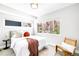 Sunlit main bedroom with modern furniture and a cozy throw blanket at 3658 Quivas St, Denver, CO 80211