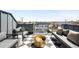 Outdoor rooftop deck with lounge seating, a chic fire pit, and expansive neighborhood views at 3658 Quivas St, Denver, CO 80211