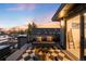 Inviting rooftop deck features a fire pit, comfortable seating, and expansive city views at 3658 Quivas St, Denver, CO 80211