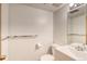 Bright bathroom with white fixtures, a modern vanity, and a large mirror at 2621 S Kingston Ct, Aurora, CO 80014
