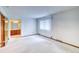 Bright bedroom with a window and a view into the bathroom at 2621 S Kingston Ct, Aurora, CO 80014